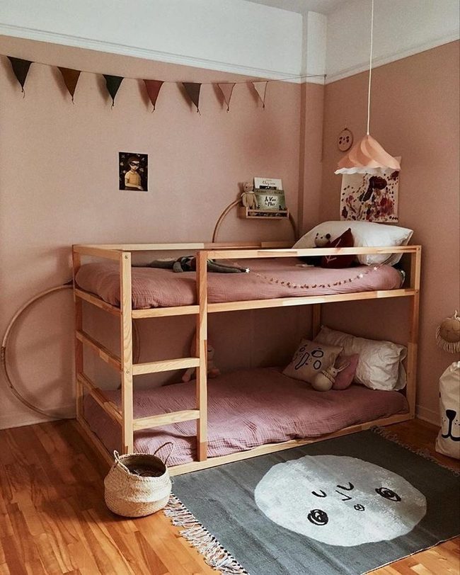 Pink Bedroom With Bunks And Triangle Flags
