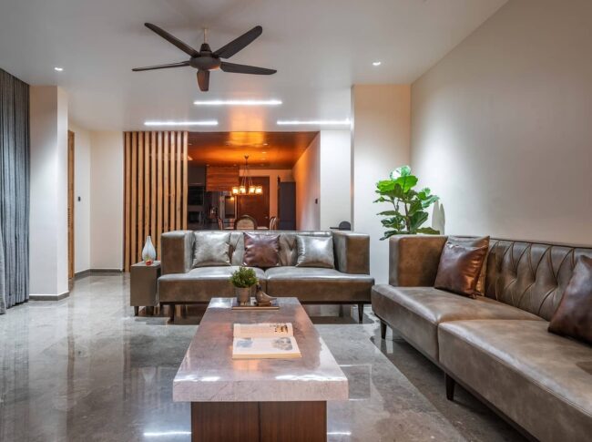 Sophisticated Grey Sofa with Shiny Accents