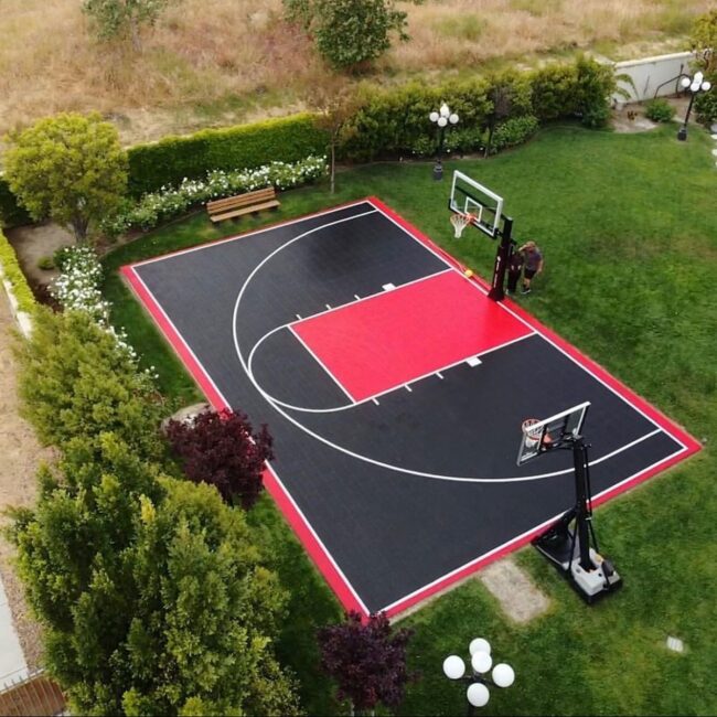 Red and Black Court Framed by Verdant Greenery