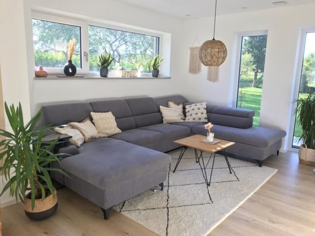Bohemian Charm: Grey Sofa in Bright Space