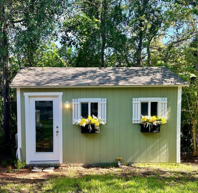 Charming Green Shed with White Accents