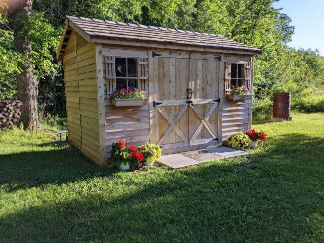 Charming Garden Shed with Floral Accents